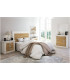 Dormitorio de la Serie Roncal, con mesitas, cabecero, cómoda y espejo.